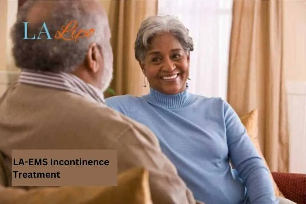 Couple sat smiling at each other - LA-EMS treatment Oxford