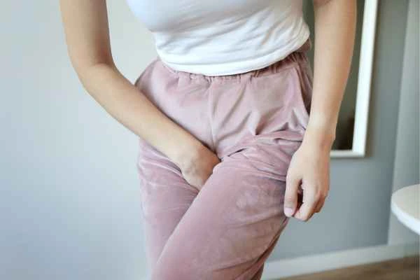 woman running for the toilet because of urinary incontinence Oxford